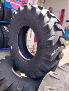 12.5/80-18 SWT 16PR industrial tyre from India with aggressive tread for heavy-duty industrial and construction equipment use.