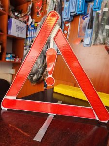 Reflective triangle safety warning sign for roadside vehicle emergencies in Kenya