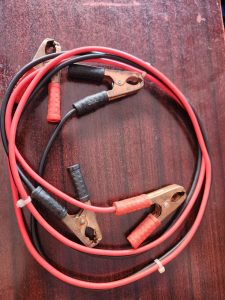 Red and black heavy duty jumper cables for vehicle battery boosting in Kenya