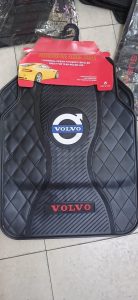 Volvo car floor mats with branded emblem and textured rubber surface