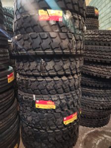 12.00R20 SUNFULL HF707 20PR off-road truck tyre with deep block-pattern tread, made in China.